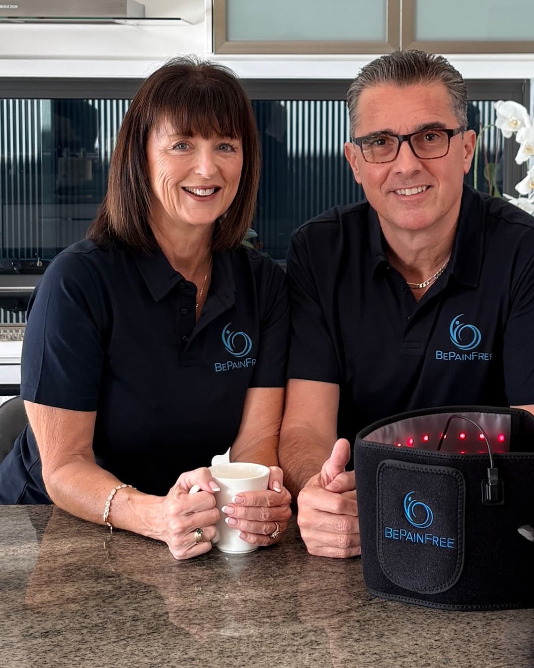Deborah and Jonathan Bispham in their Be Pain Free polos with the Back and Body Wrap