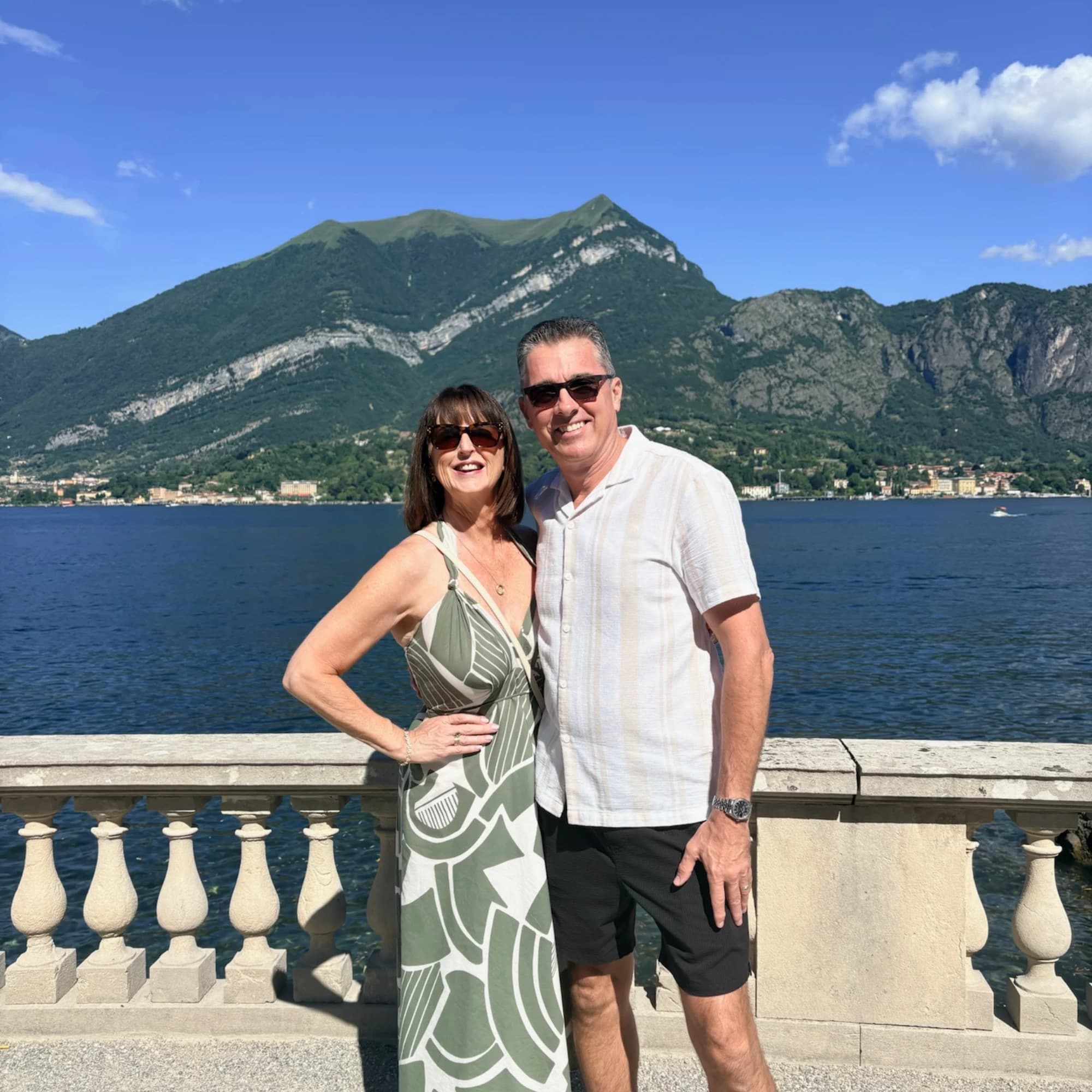 Deborah and Jonathan Bispham travelling together beside a lake and mountains