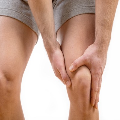 man holding sore knee